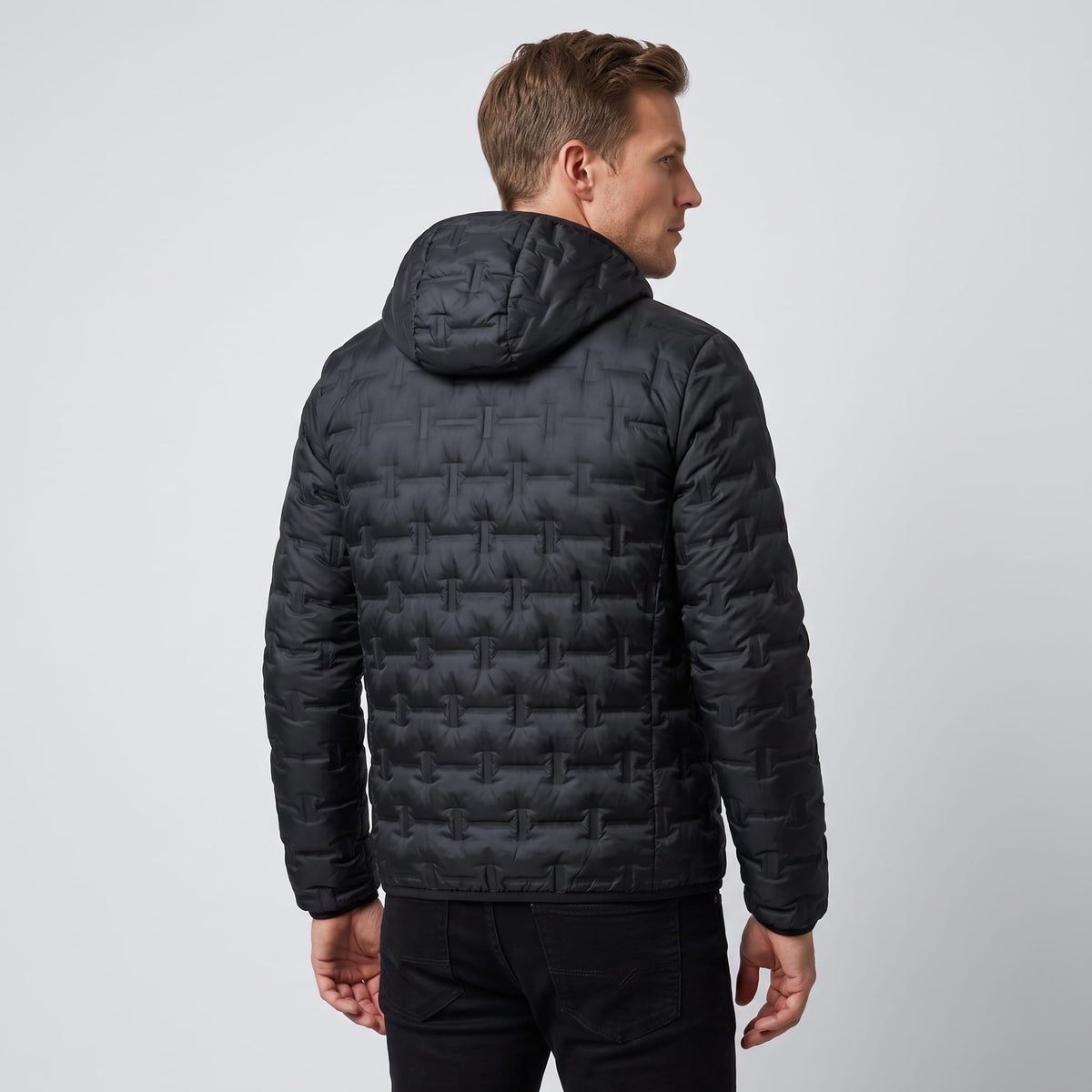 Back view of the black jacket with the hood lying flat at the shoulders
