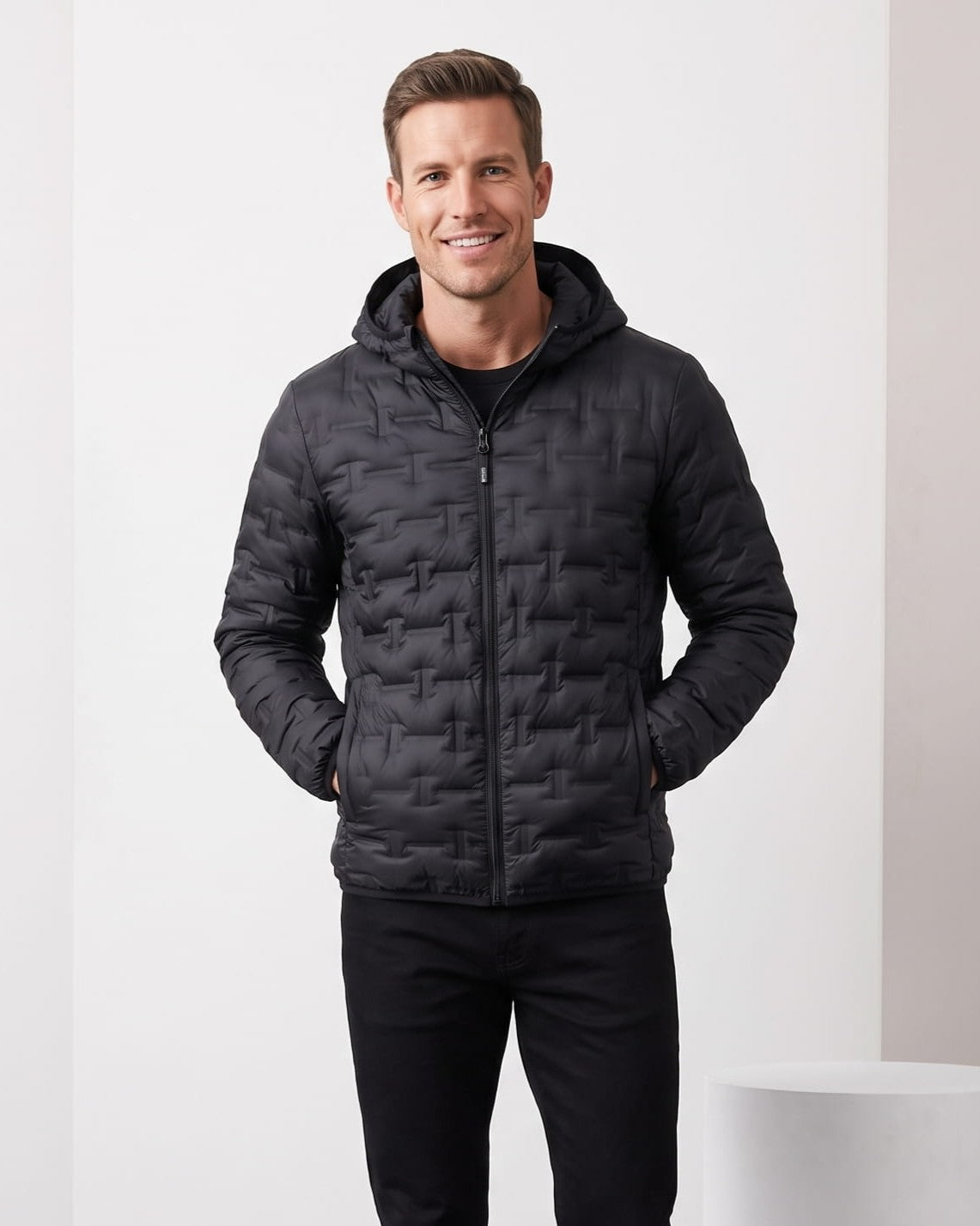Black colorway worn hooded and zipped over dark trousers