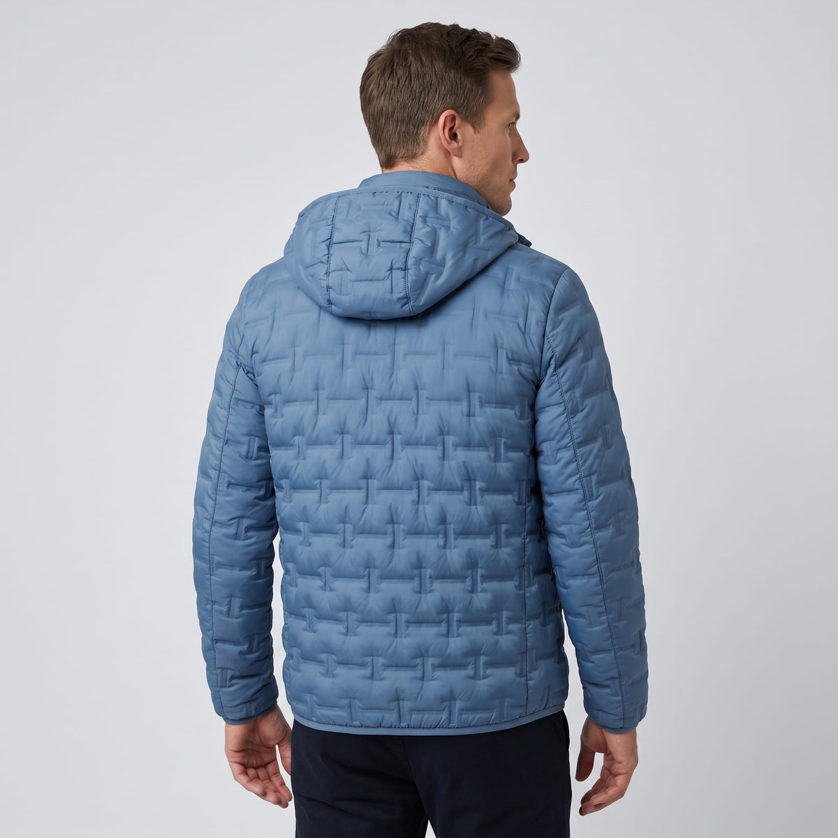 Back view of the blue colorway showing the hood and quilt pattern