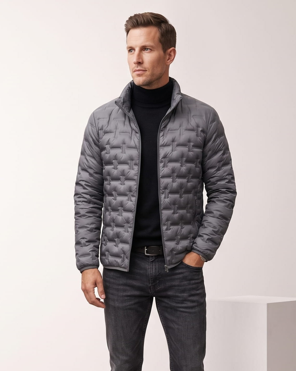 Man wearing gray lightweight down puffer jacket with basketweave quilting