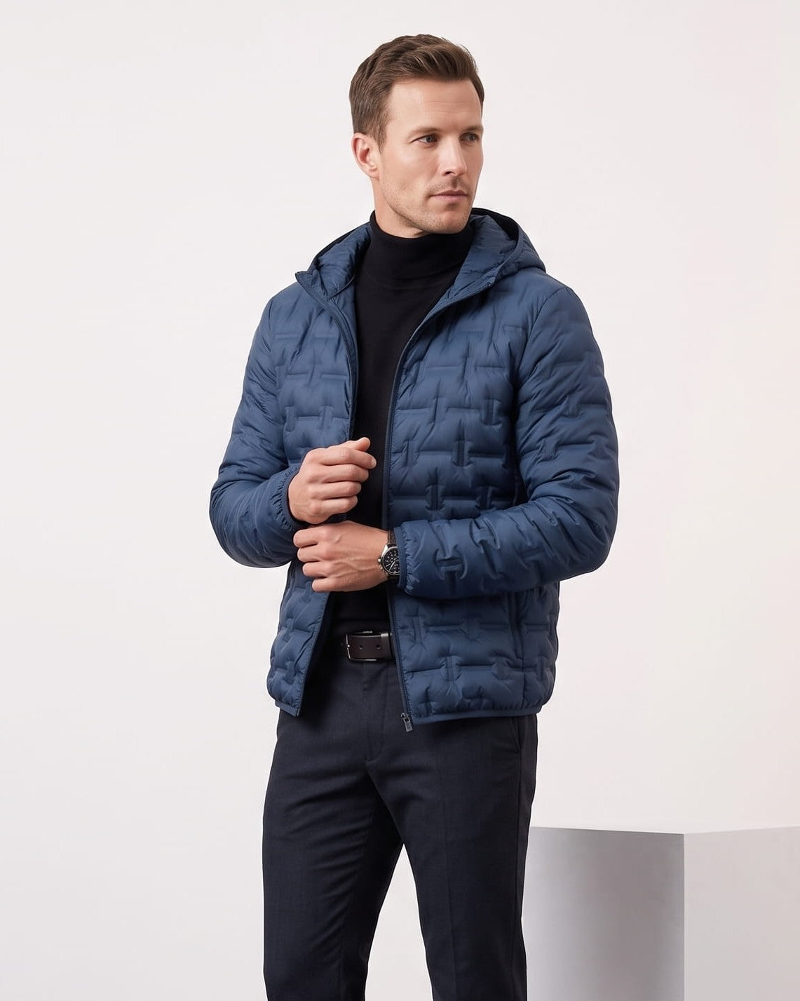 Navy colorway worn with the hood down, jacket open over a turtleneck