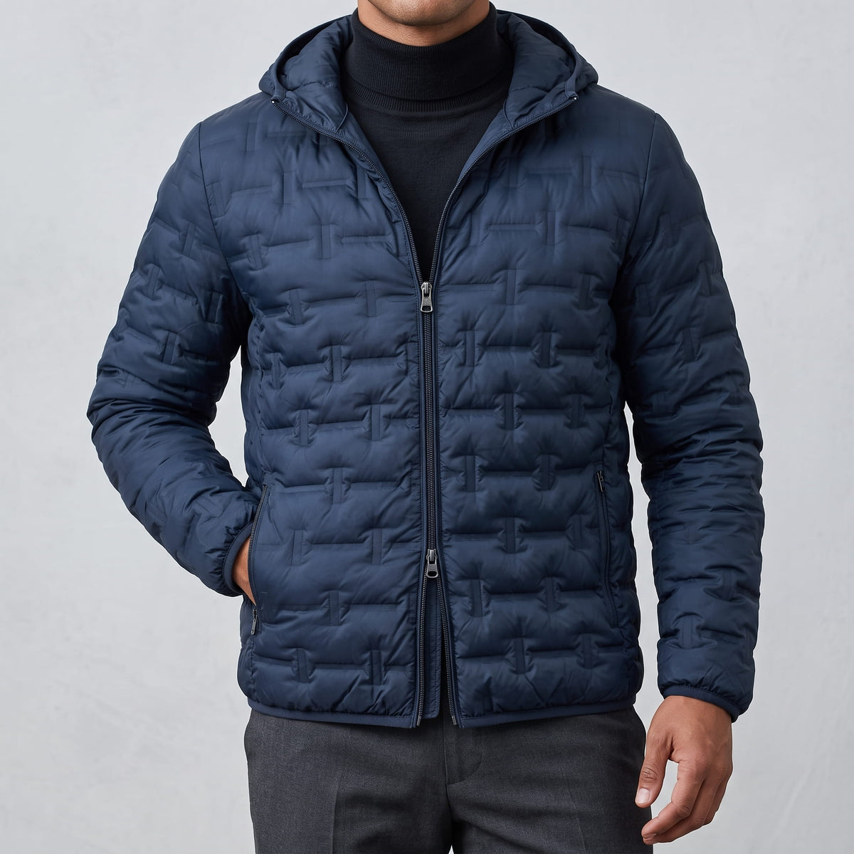 Navy jacket zipped with the hood sitting flat behind the neck