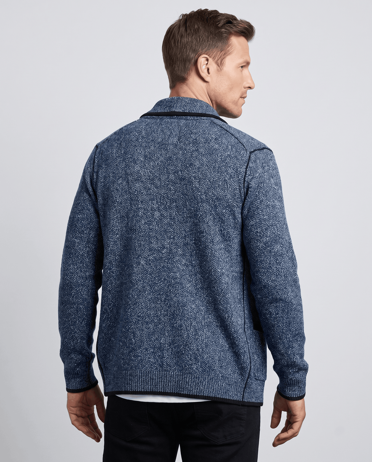 Back view of the blue marled knit cardigan with black trim