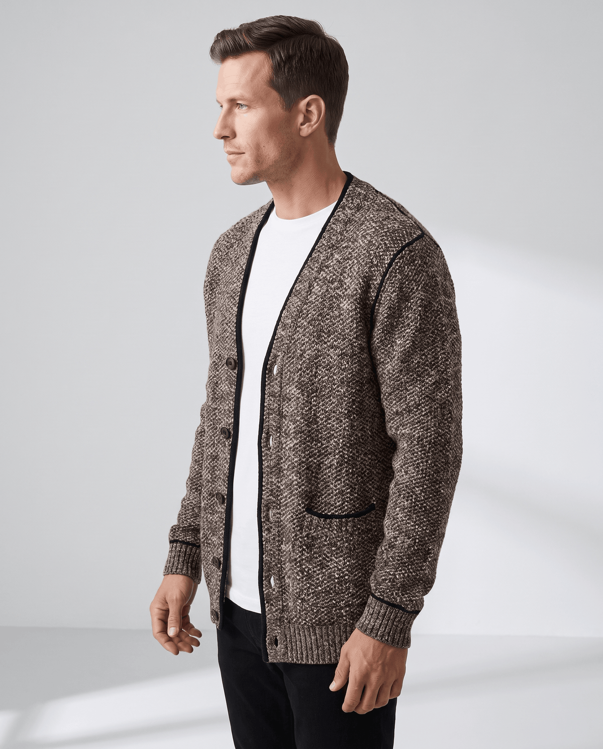 Three-quarter view of the brown cardigan showing a trimmed hip pocket