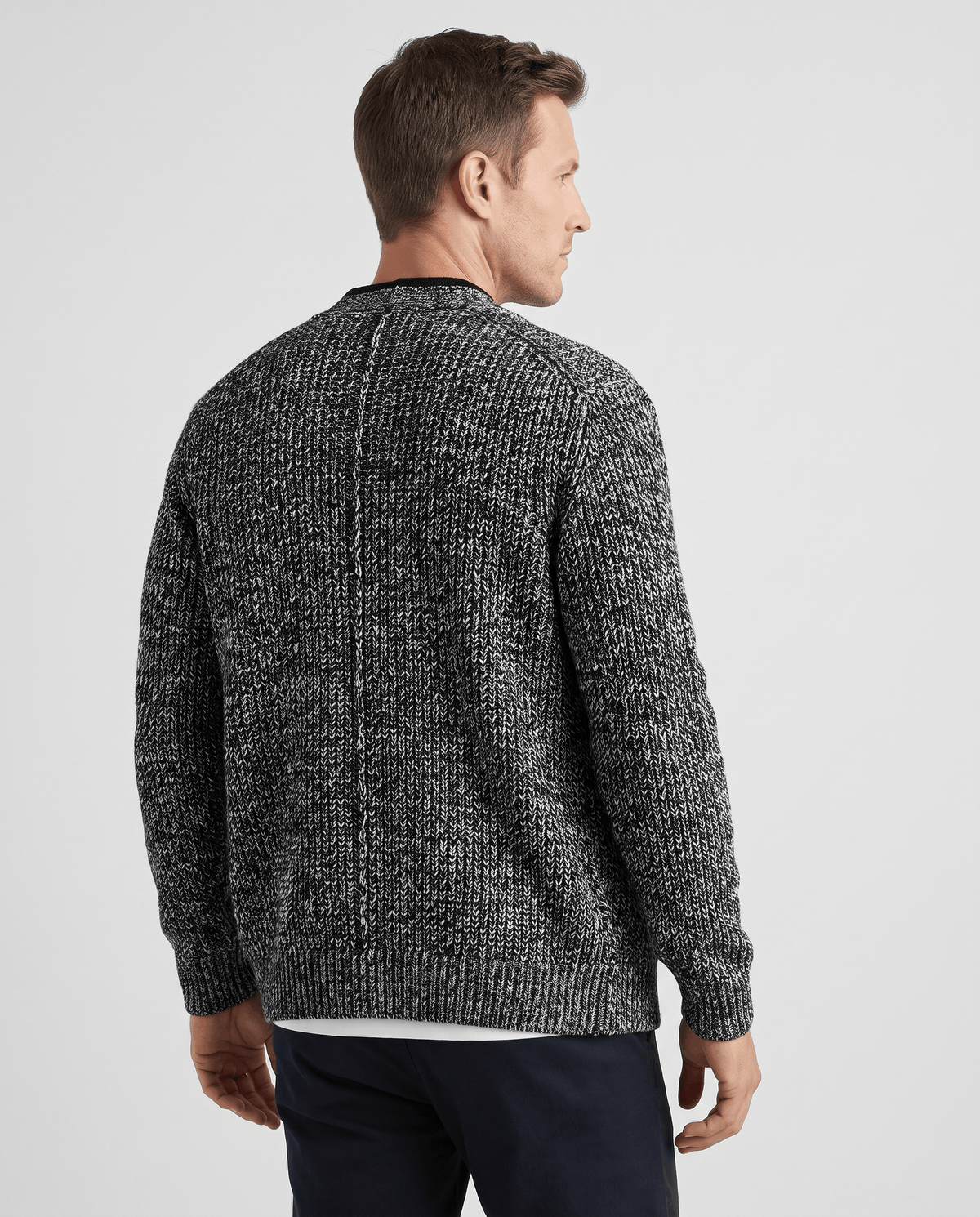 Back view of the dark gray marled knit cardigan with ribbed hem