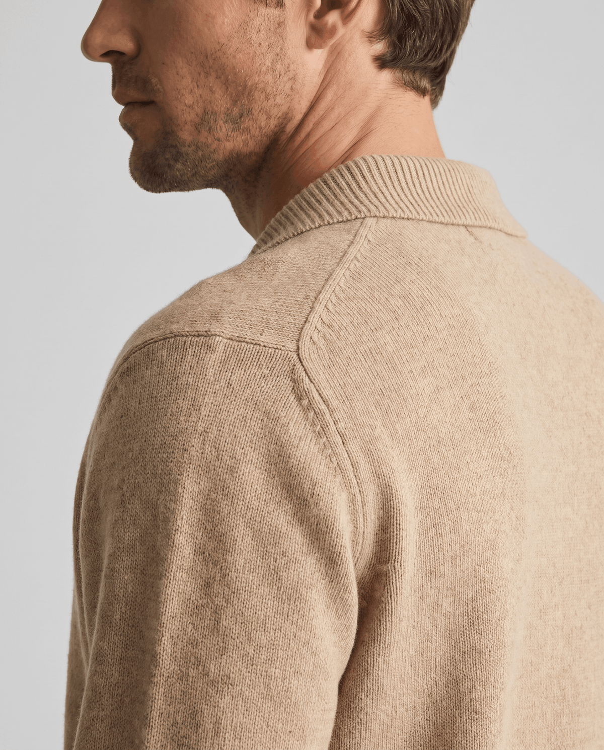 Side profile of the camel knit showing the collar and shoulder seam