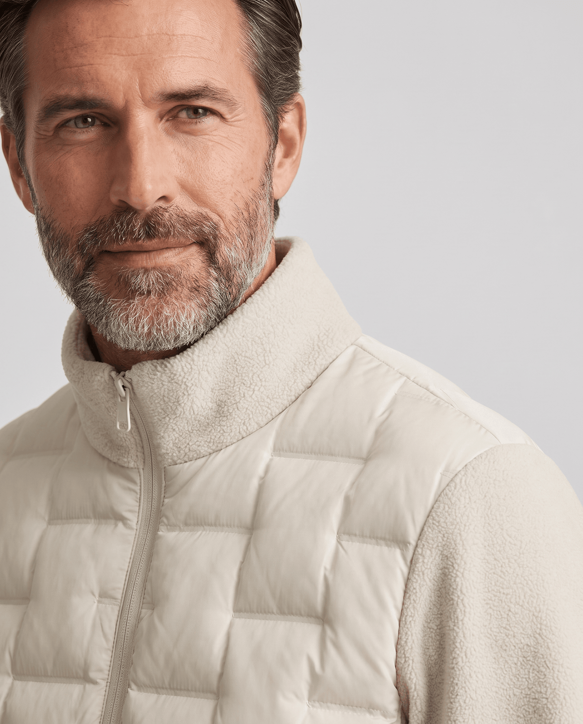 Close-up of the stand collar on an off-white hybrid puffer jacket