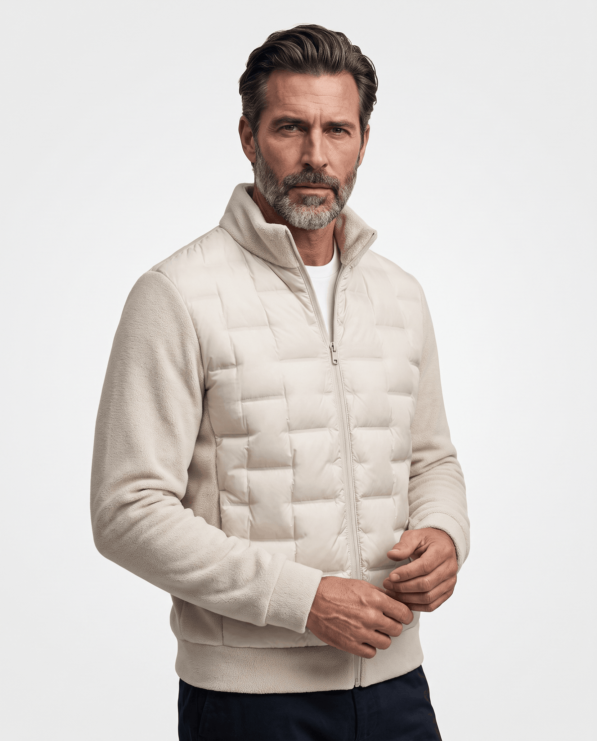 Man wearing an off-white hybrid puffer jacket with quilted body and fleece sleeves, front view