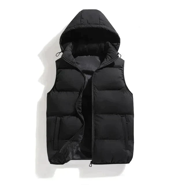 Black padded vest with detachable hood and front pockets laid flat