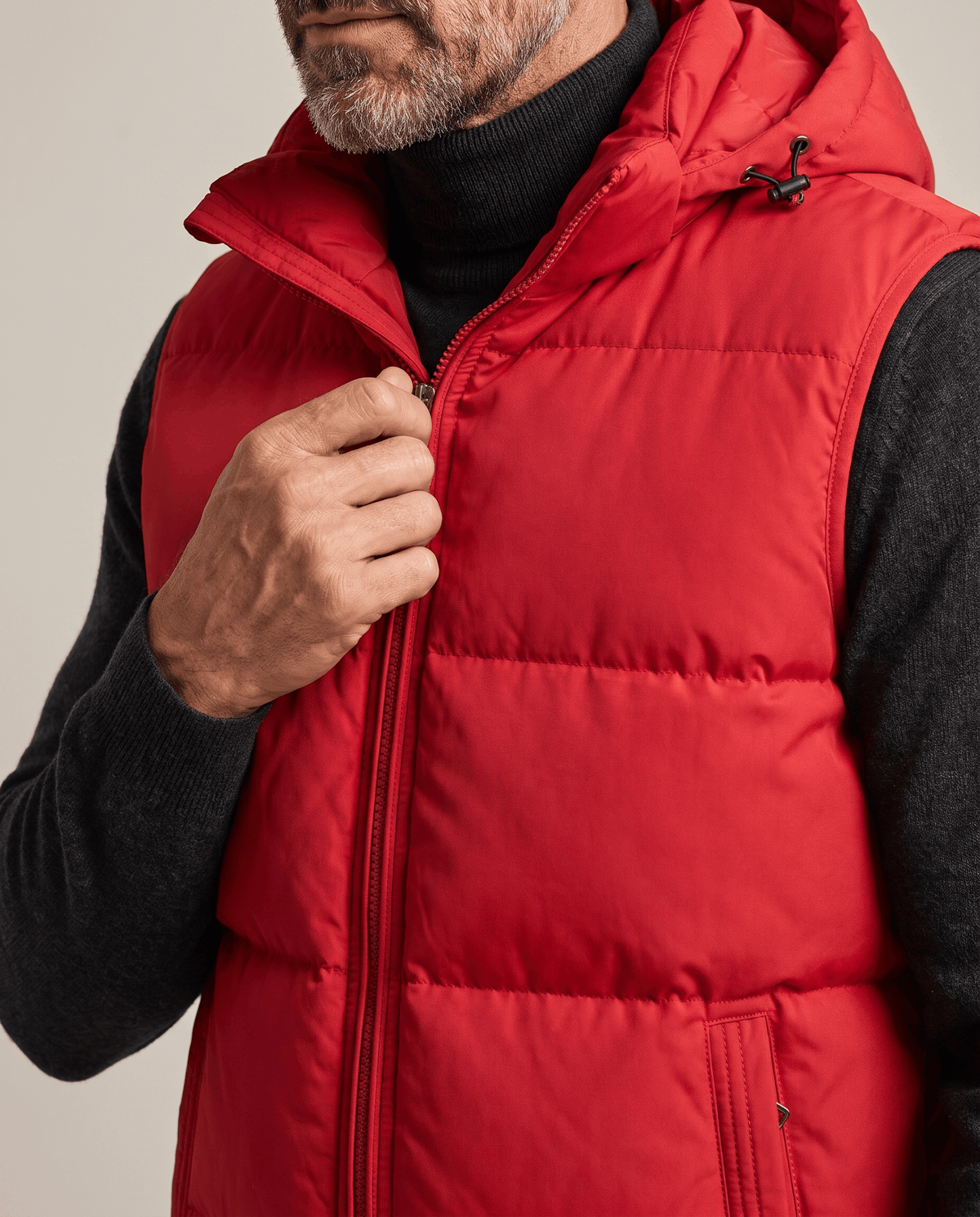 Red padded vest front zip and horizontal panels shown in close view