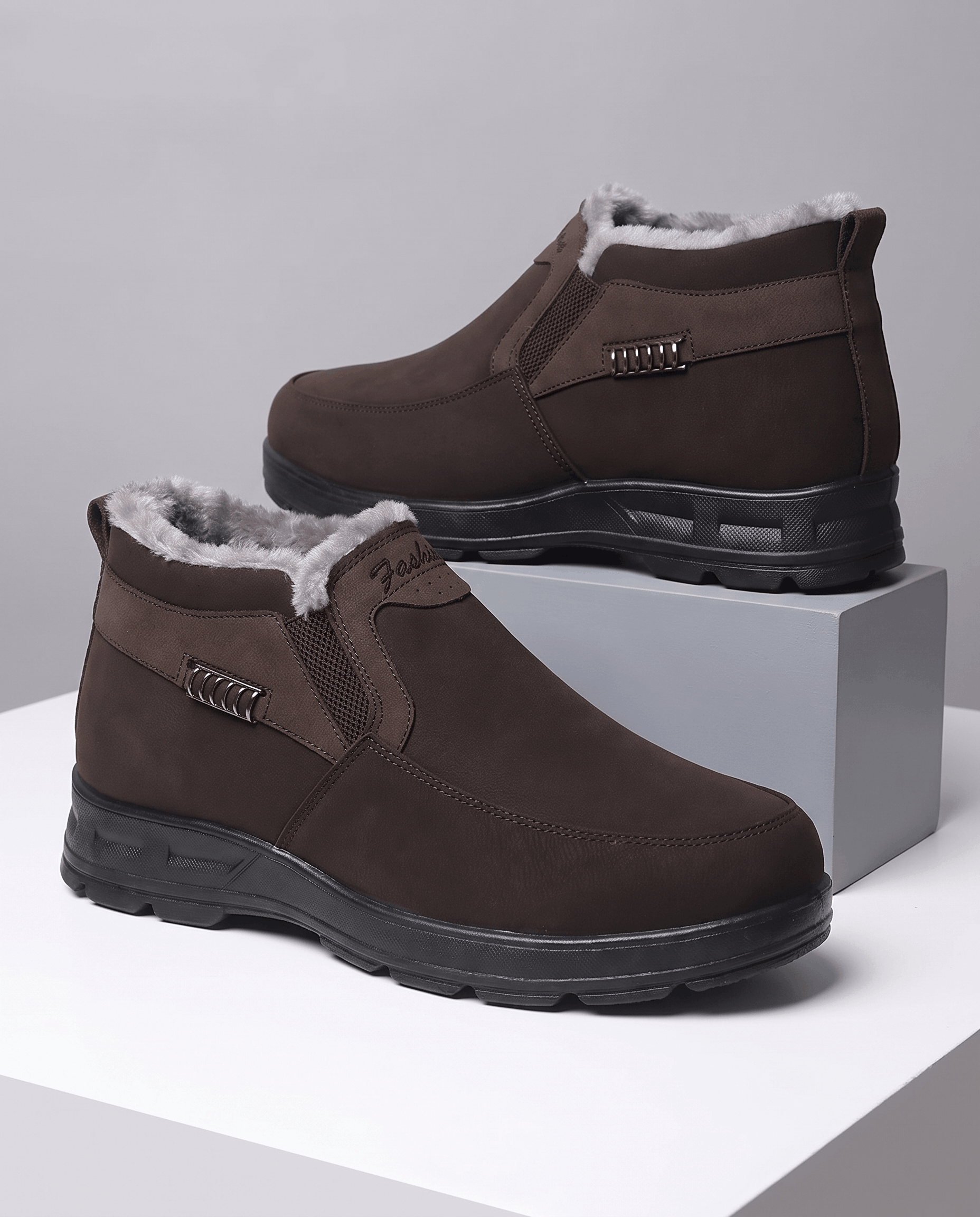 Pair of brown fleece-lined ankle boots displayed on a white background.