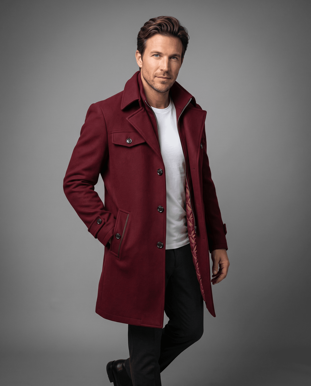 Burgundy overcoat with a double collar and chest pockets, worn over a white tee