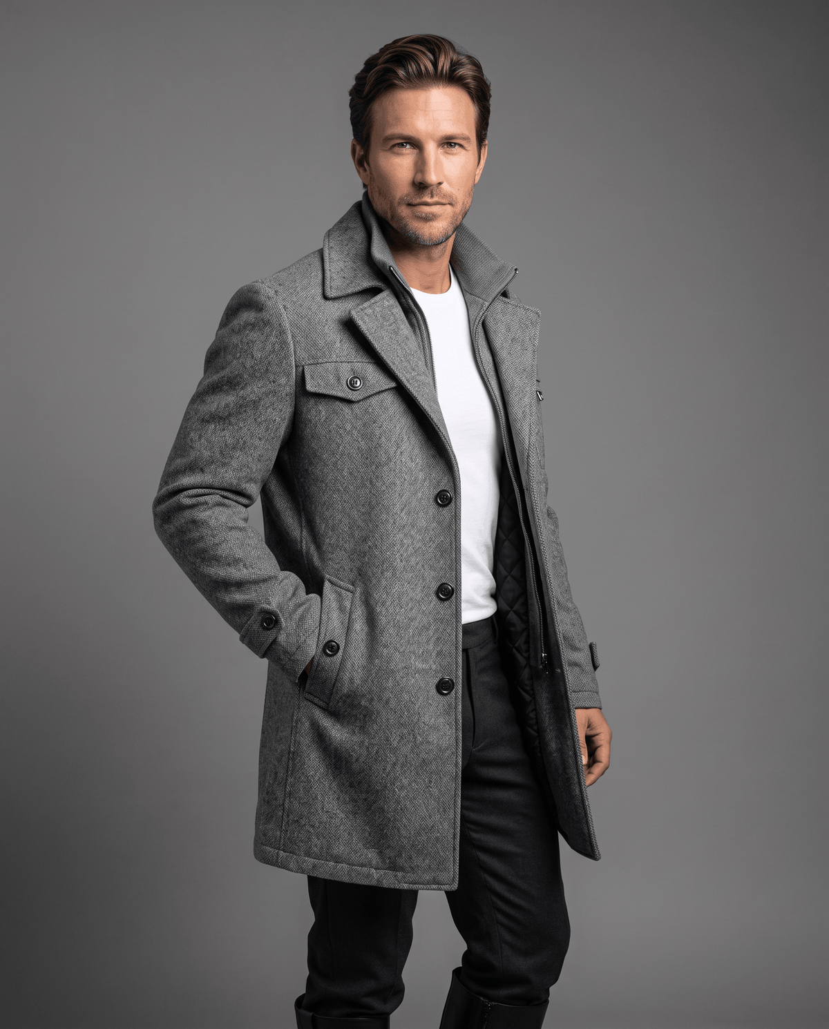 Gray overcoat with a double collar and chest pockets, worn open over a white tee