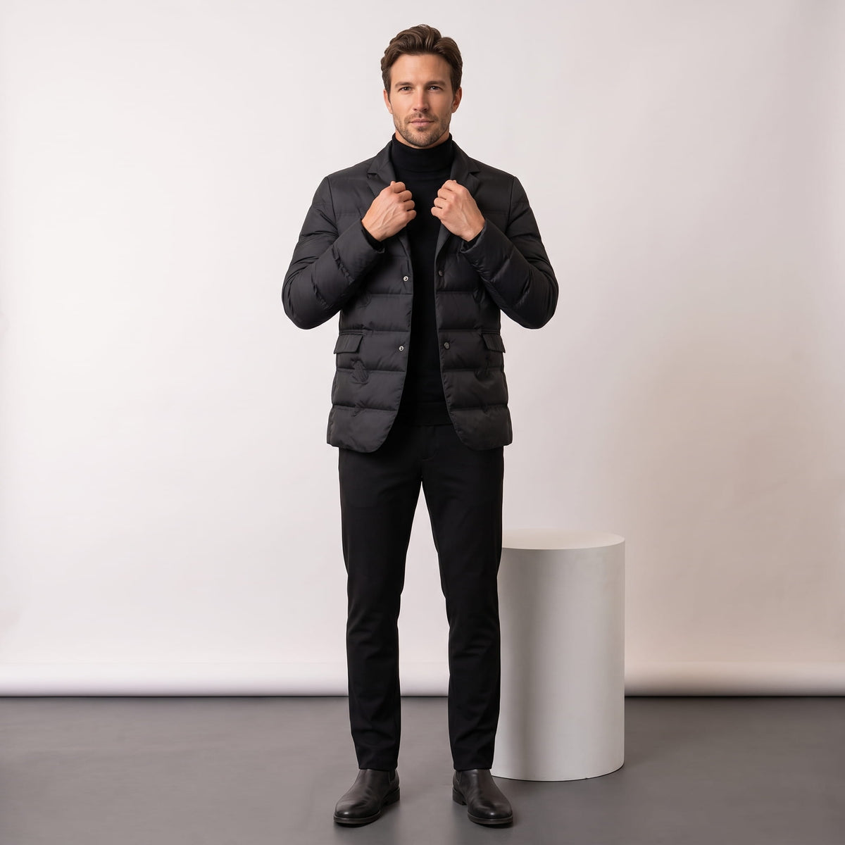 Black blazer styled full-length with dark trousers and Chelsea boots