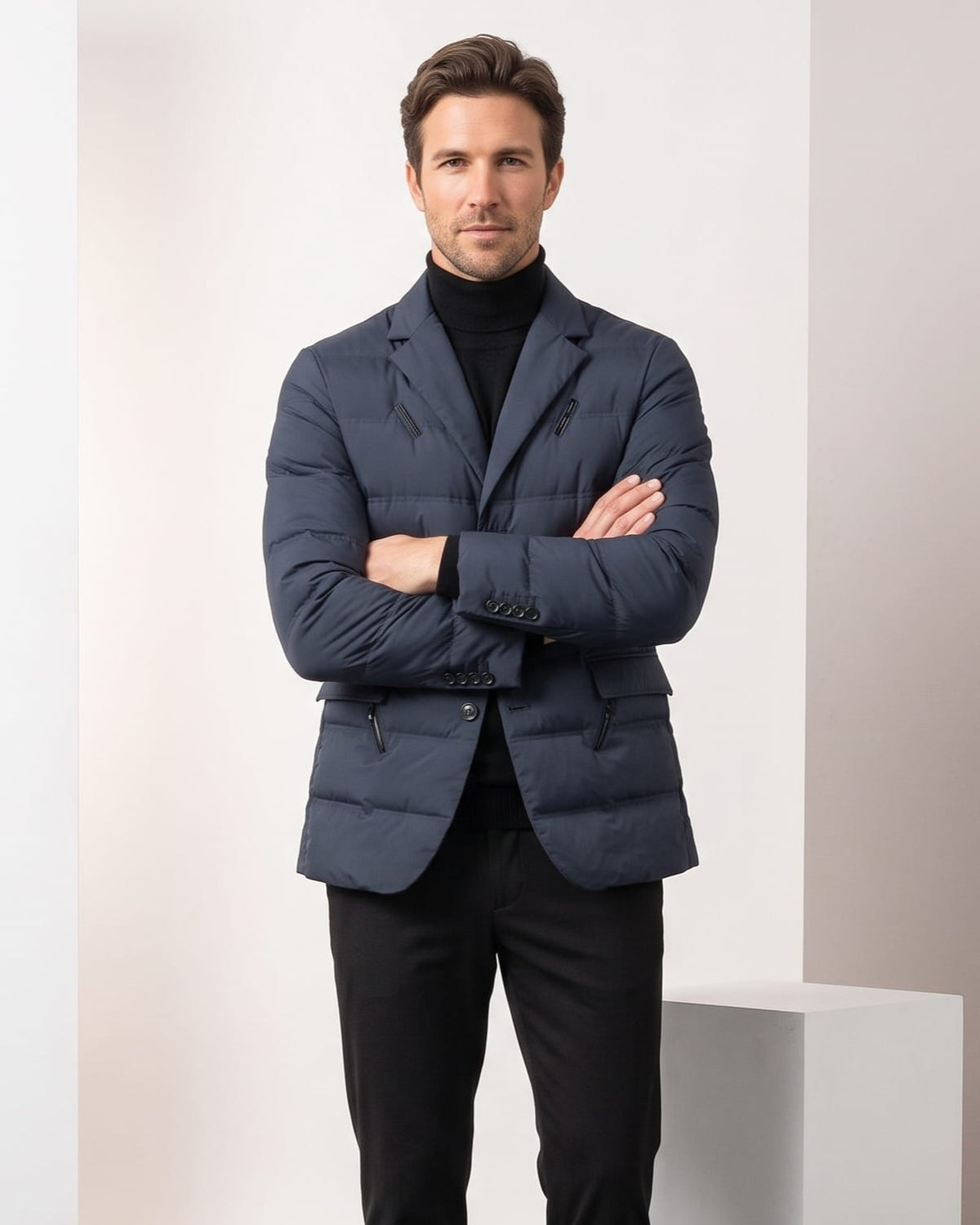 Navy colorway worn with arms crossed over a black turtleneck