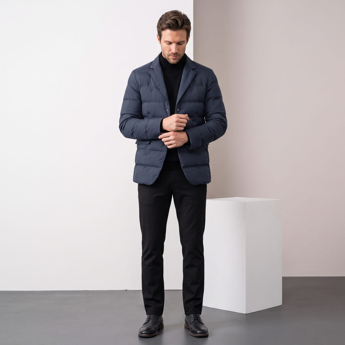 Navy blazer styled full-length with black trousers and leather boots