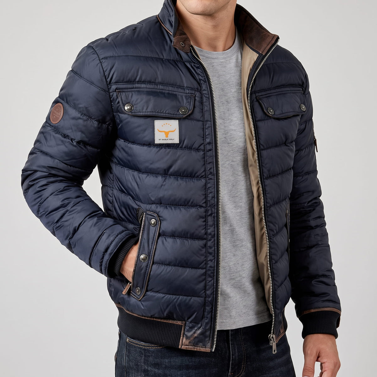 Jacket worn open over a grey sweatshirt, hand resting in the lower pocket