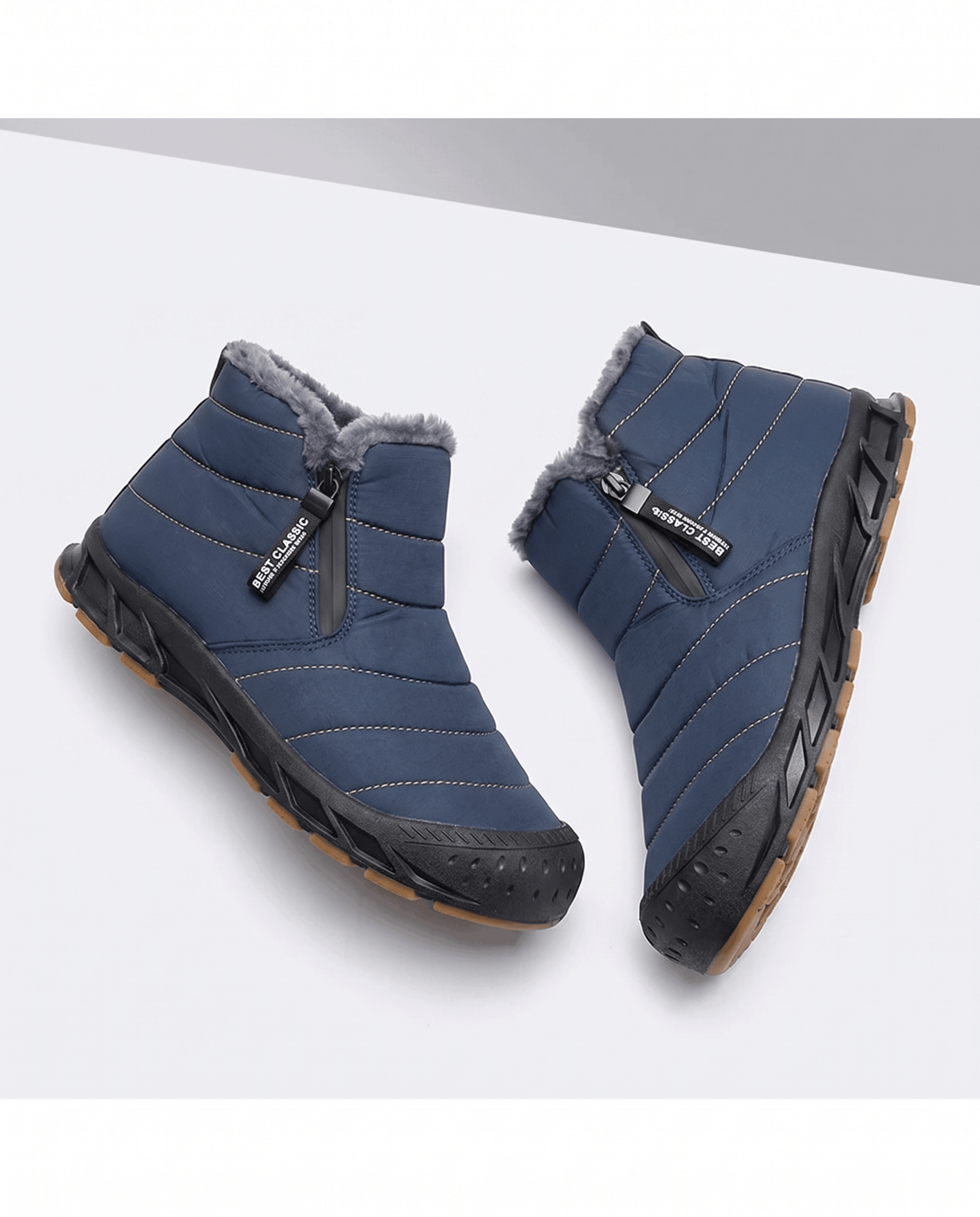 Pair of blue insulated ankle boots displayed together.