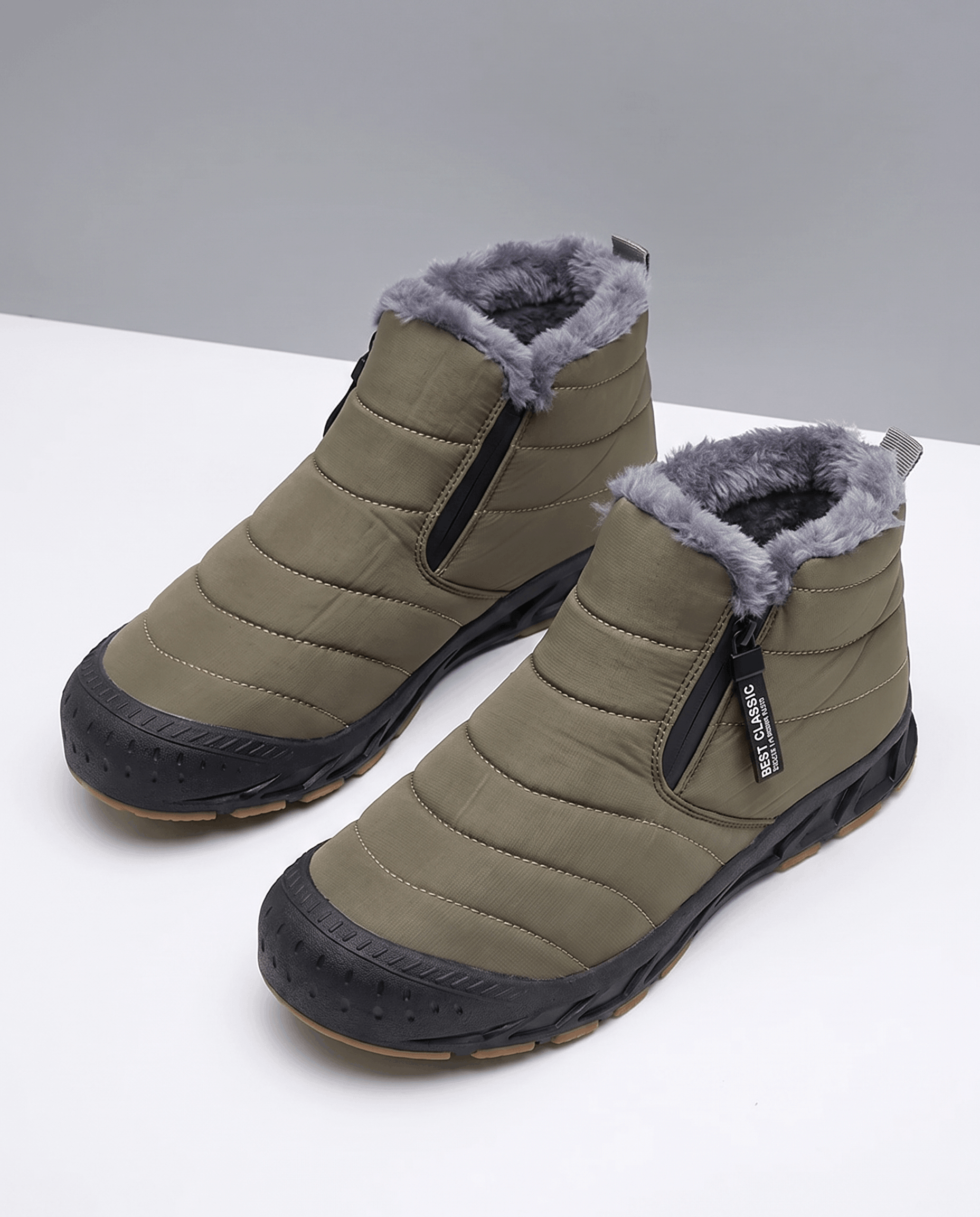 Pair of green insulated ankle boots displayed together.