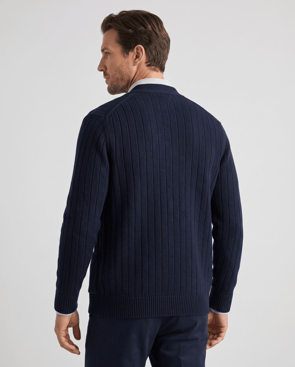 Back view of the navy ribbed knit cardigan with a ribbed hem