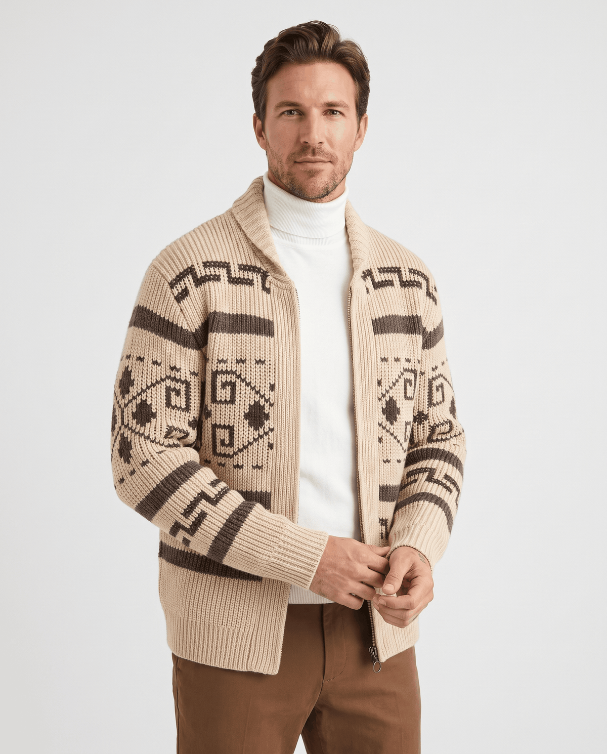 Men's khaki geometric jacquard zip cardigan with shawl collar worn over a white turtleneck