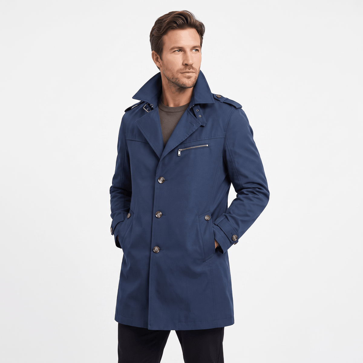Navy blue single-breasted trench coat with a storm flap, chest pocket and waist pockets.