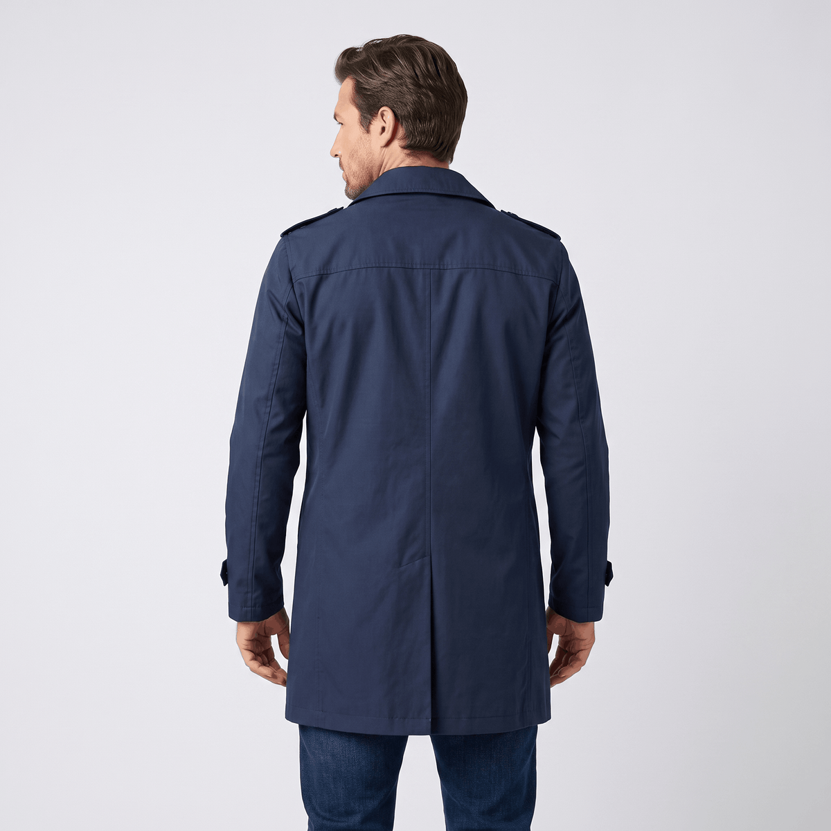 Back view of a navy blue men's trench coat.