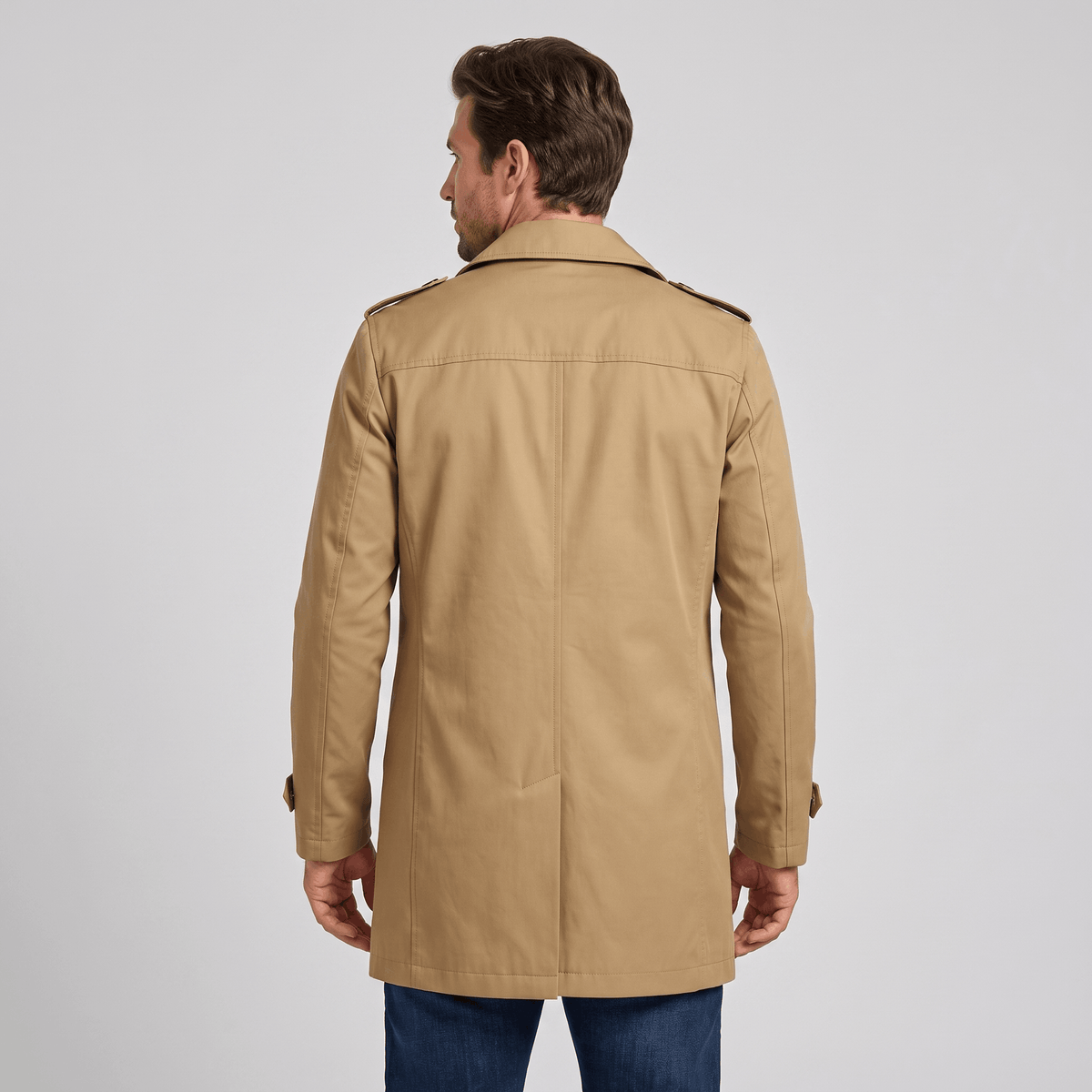 Back view of a beige trench coat.