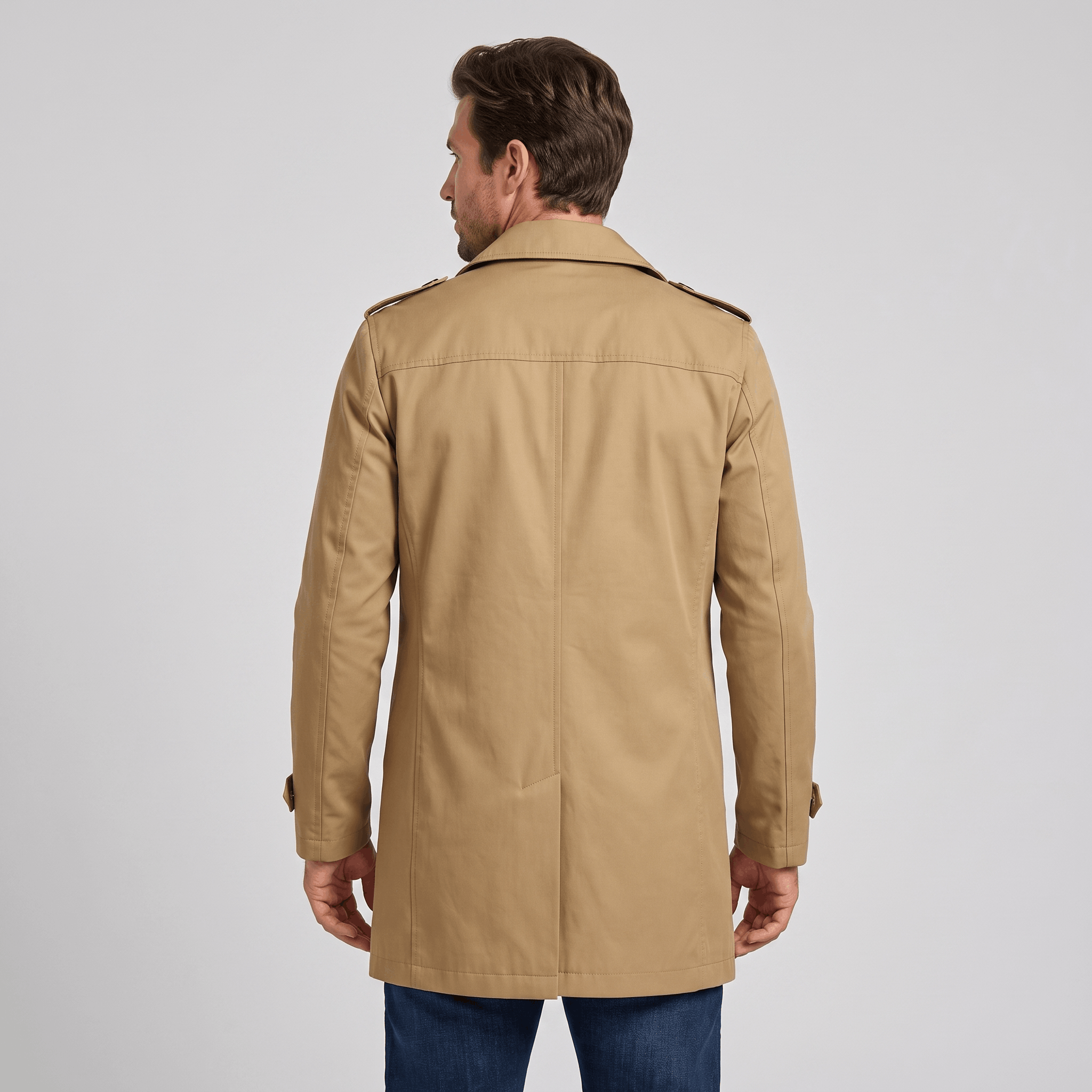 Back view of a beige trench coat.
