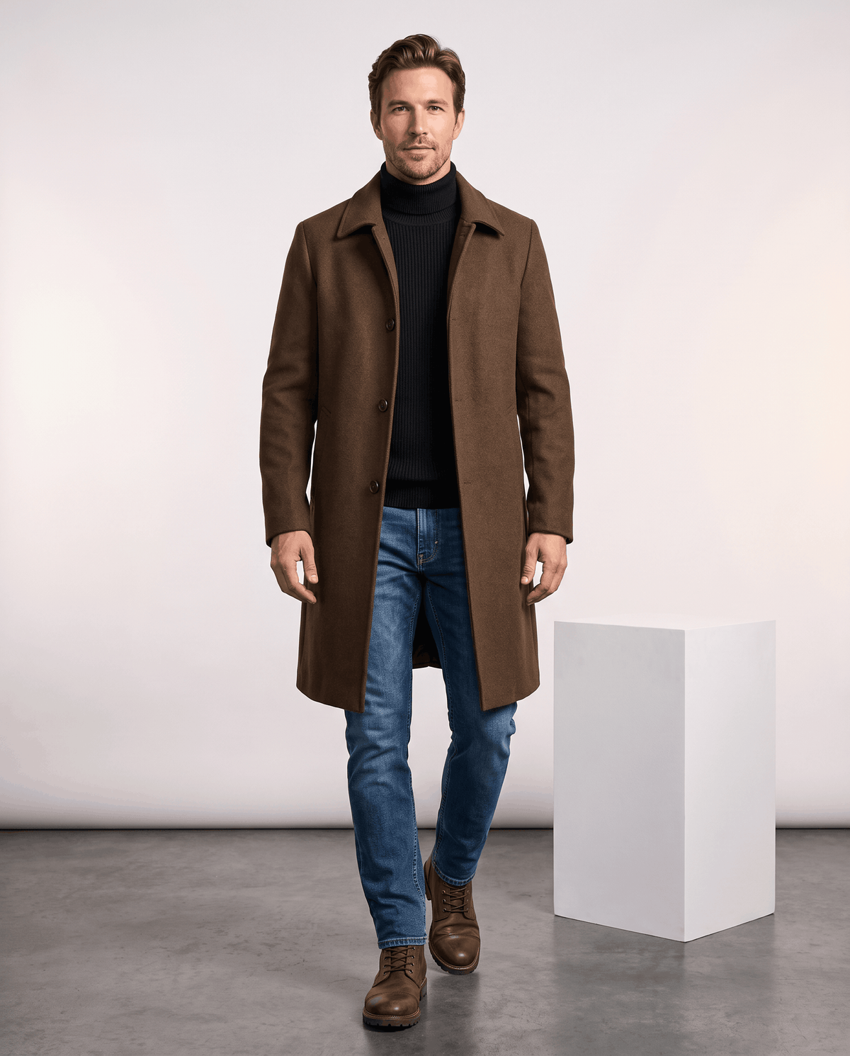Full-length view of the brown overcoat worn with jeans and brown boots