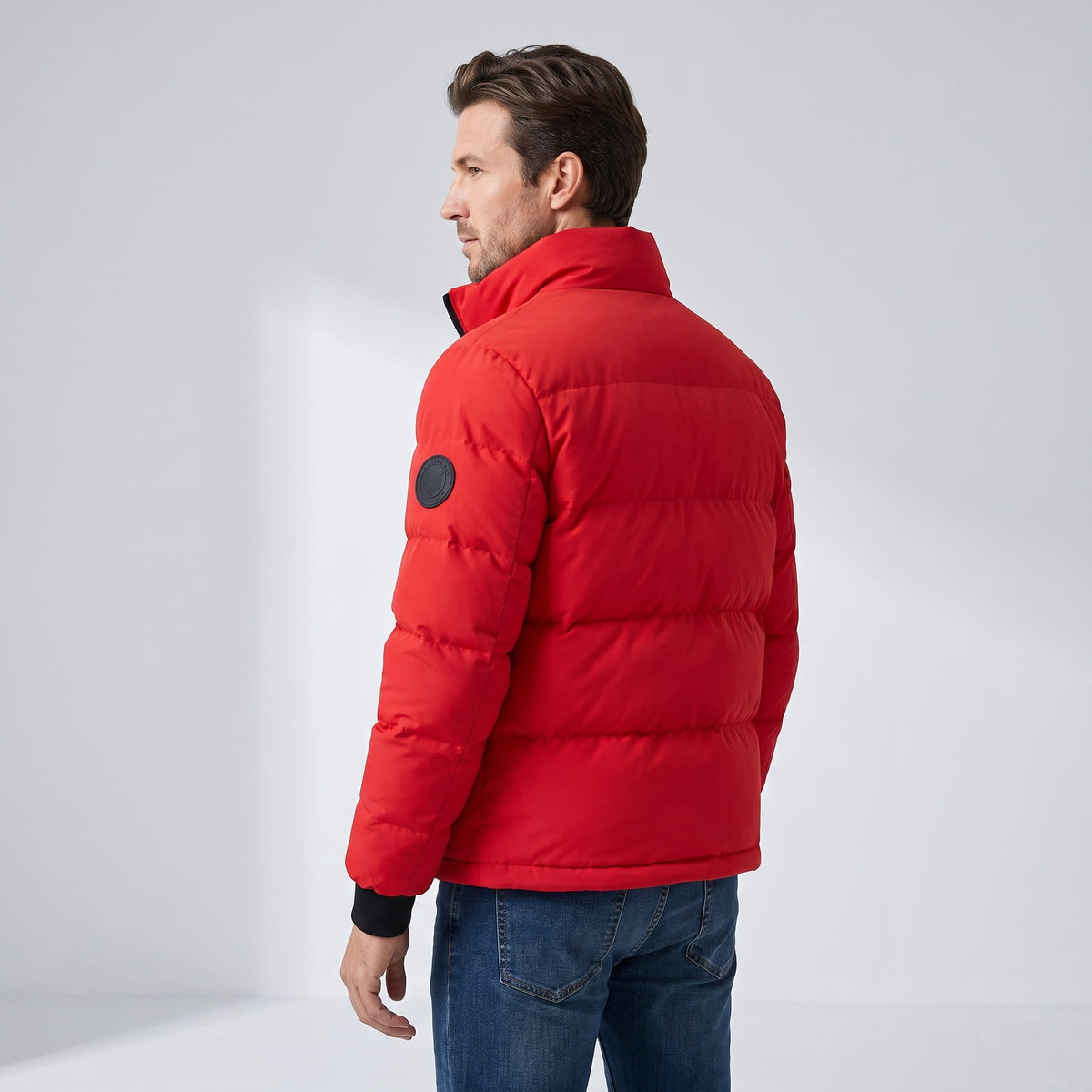Back view in red with horizontal quilted blocks and circular sleeve patch