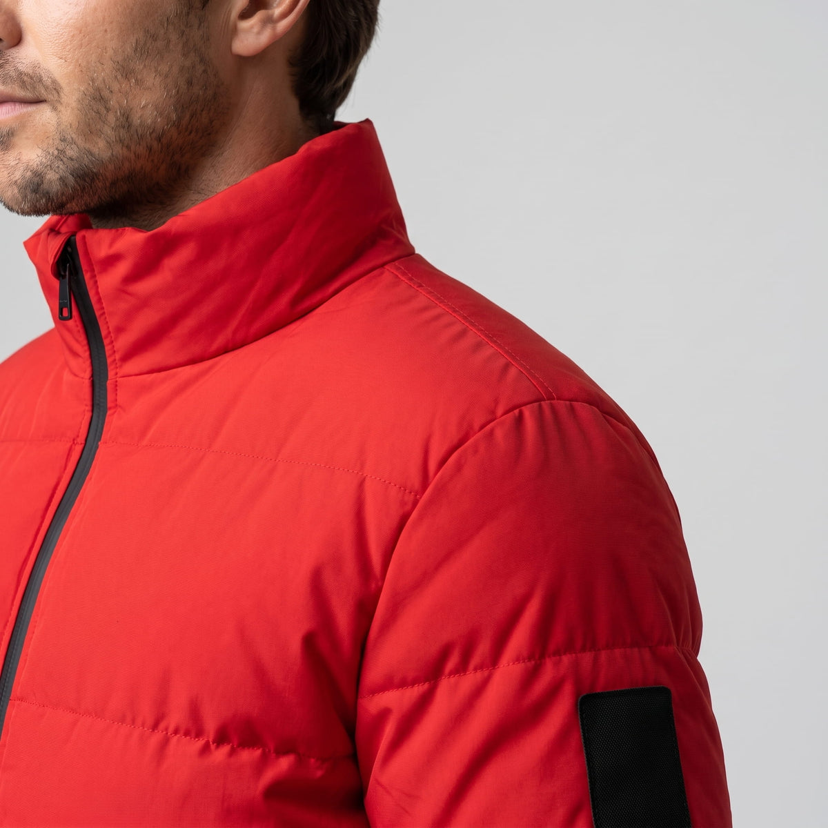 Collar and shoulder detail in red, showing the upright stand collar height