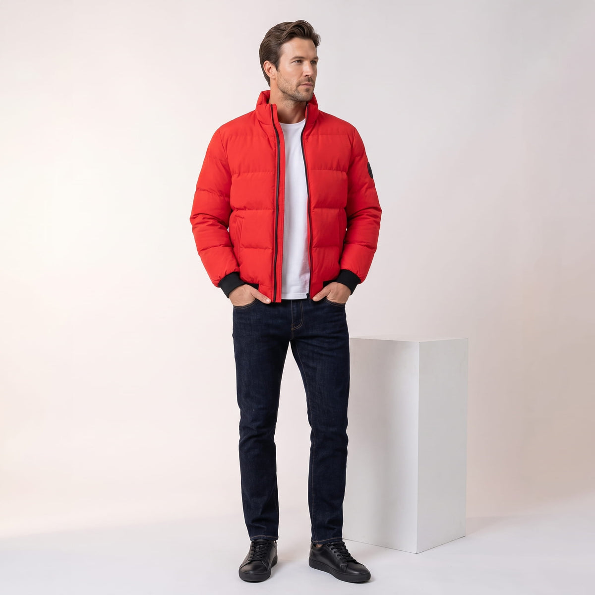 Red jacket styled full-length with dark jeans and black leather boots