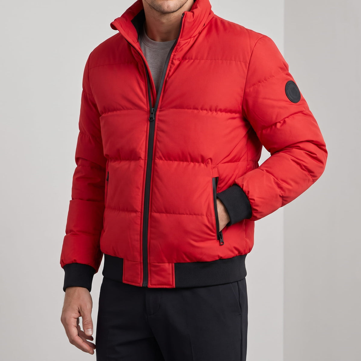 Red jacket zipped, hand in pocket, ribbed hem sitting at the hip