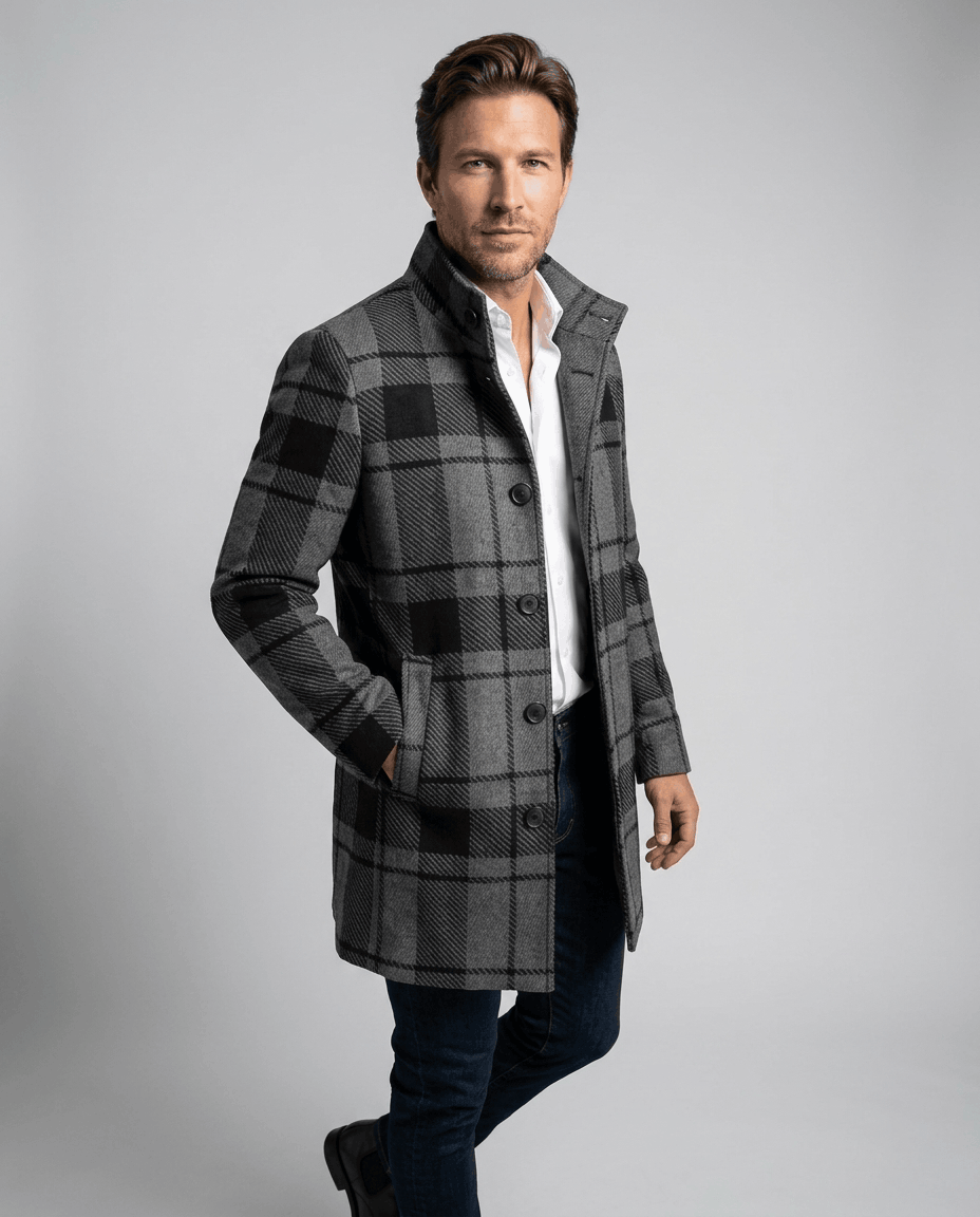Black and gray plaid overcoat with a stand collar, worn over a white shirt