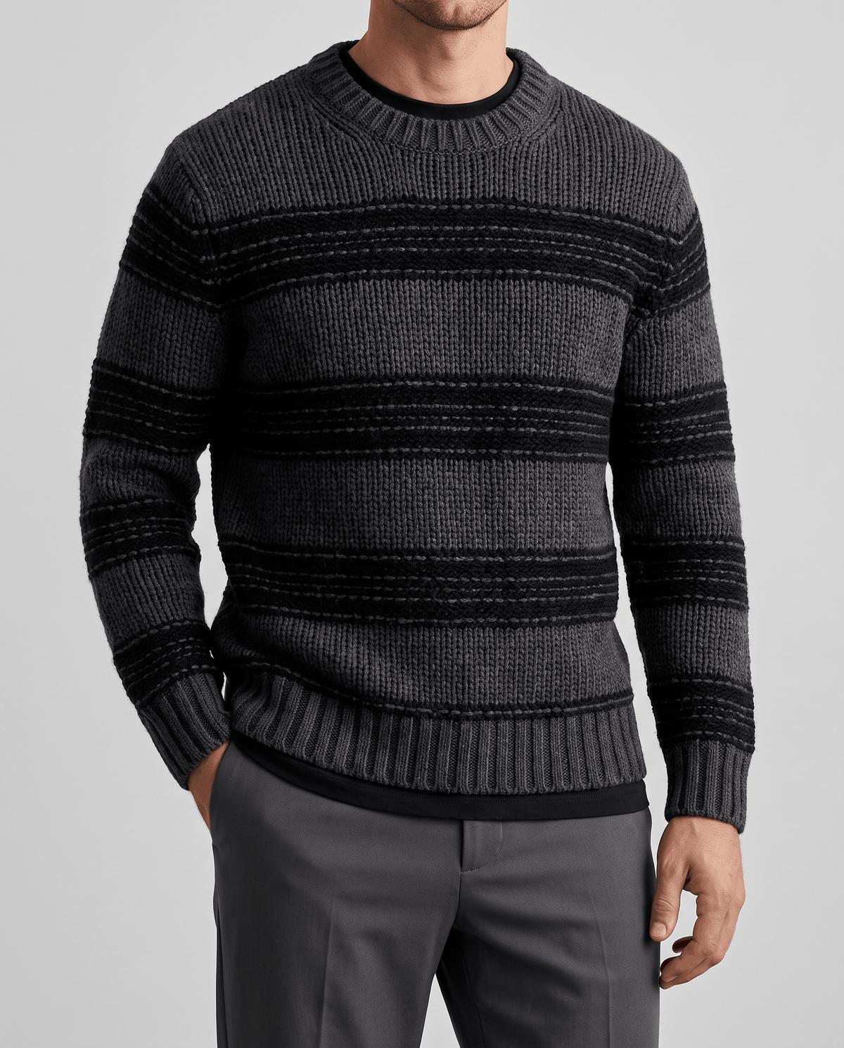 Front close-up of black and charcoal striped knit over a dark tee