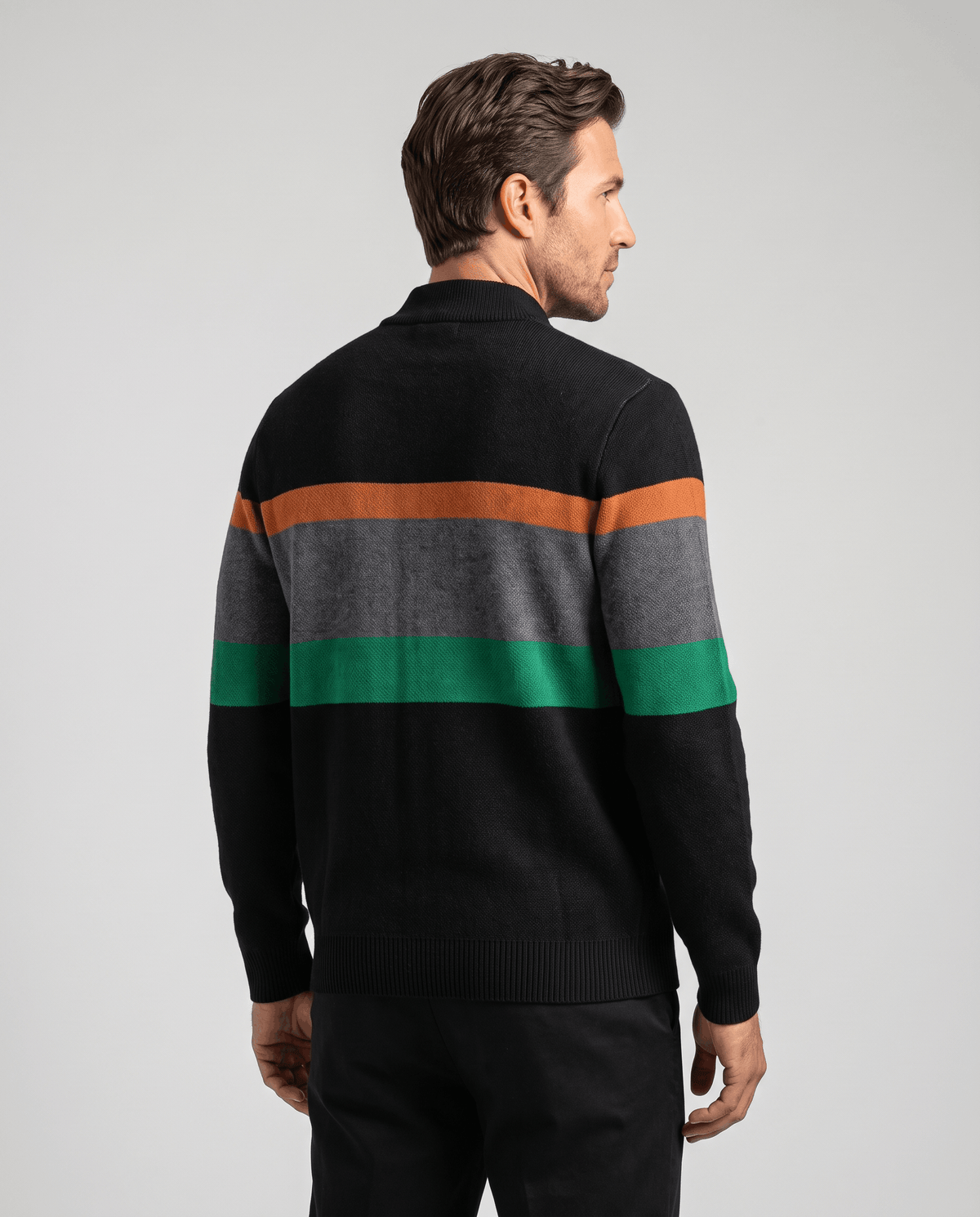 Back view of black knit cardigan showing orange, gray and green stripes across the shoulders