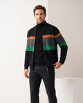 Man wearing a black striped full-zip cardigan sweater with orange, gray and green bands