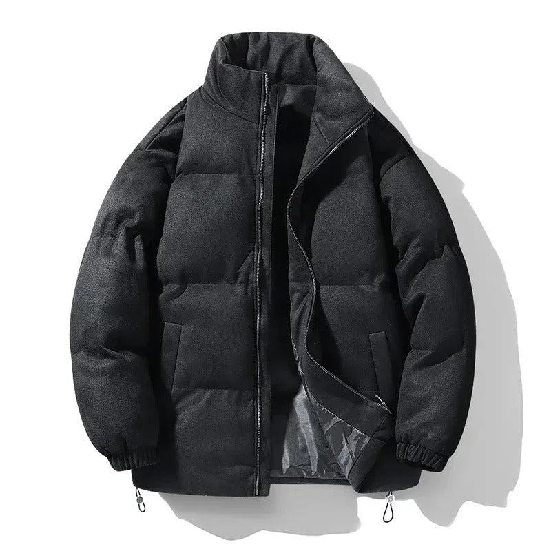 Flat shot of the black jacket open, showing the inner lining and hem cord