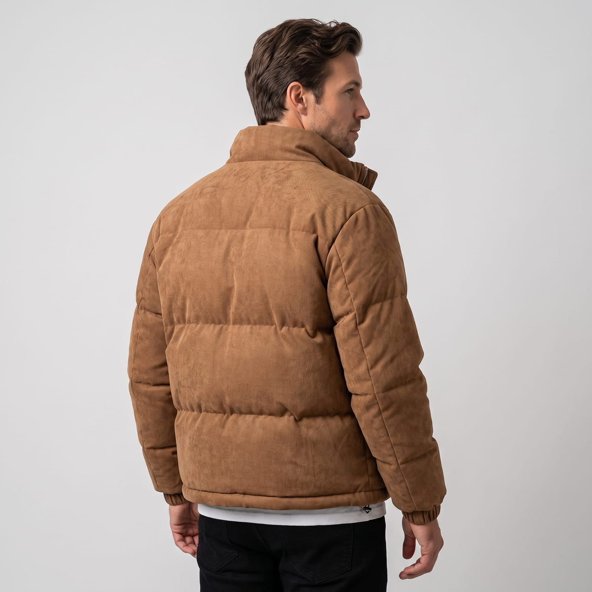 Back view in brown showing the raised collar and blocky quilting across the body