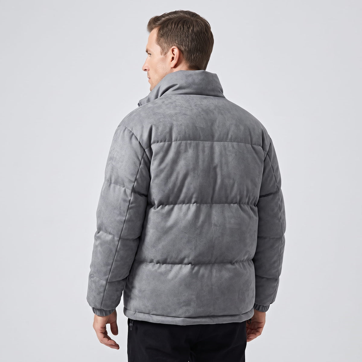Back view of the gray jacket showing quilted blocks and hip-length hem