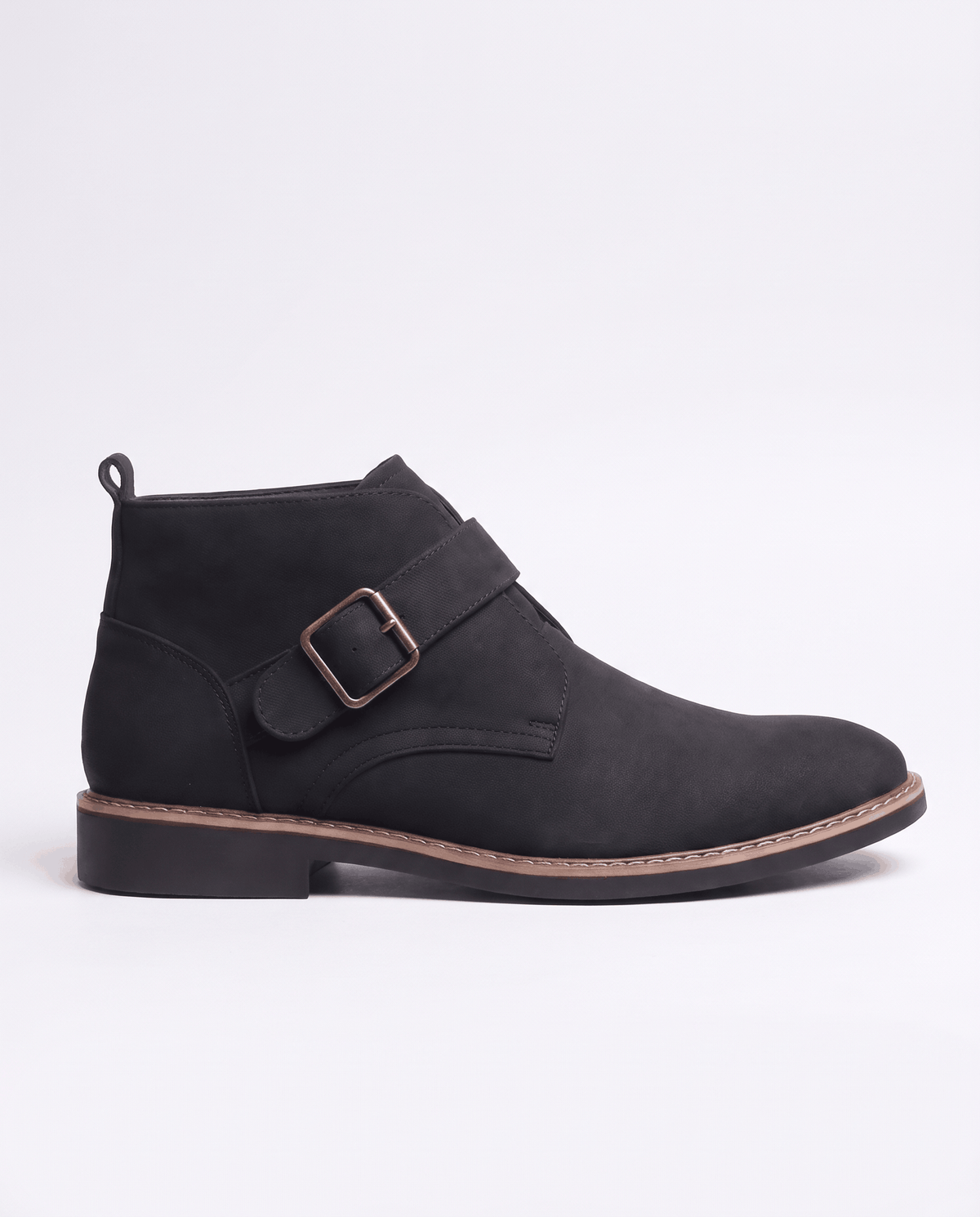 Black suede boot in full side profile showing the buckle strap and heel pull tab