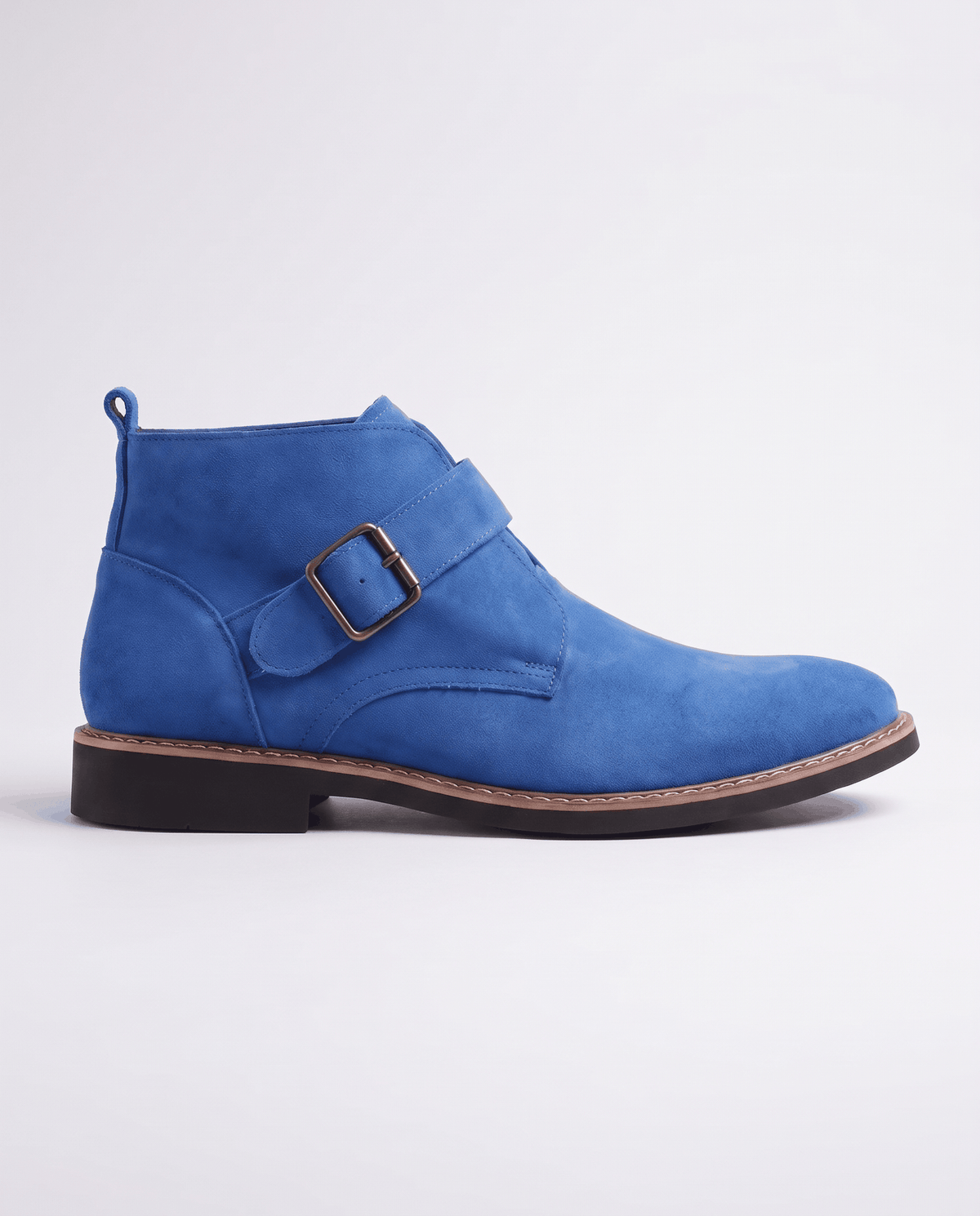 Blue suede boot in side profile with buckle strap, heel pull tab and dark sole