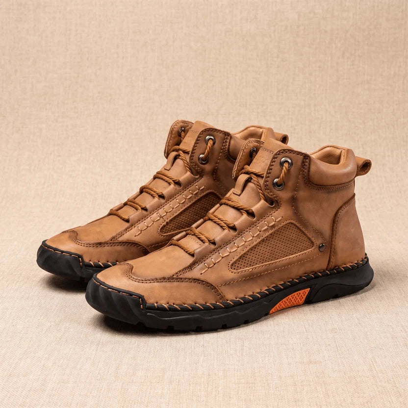 Pair of tan vegan leather wide toe box hiking boots with lace-up front and lug sole