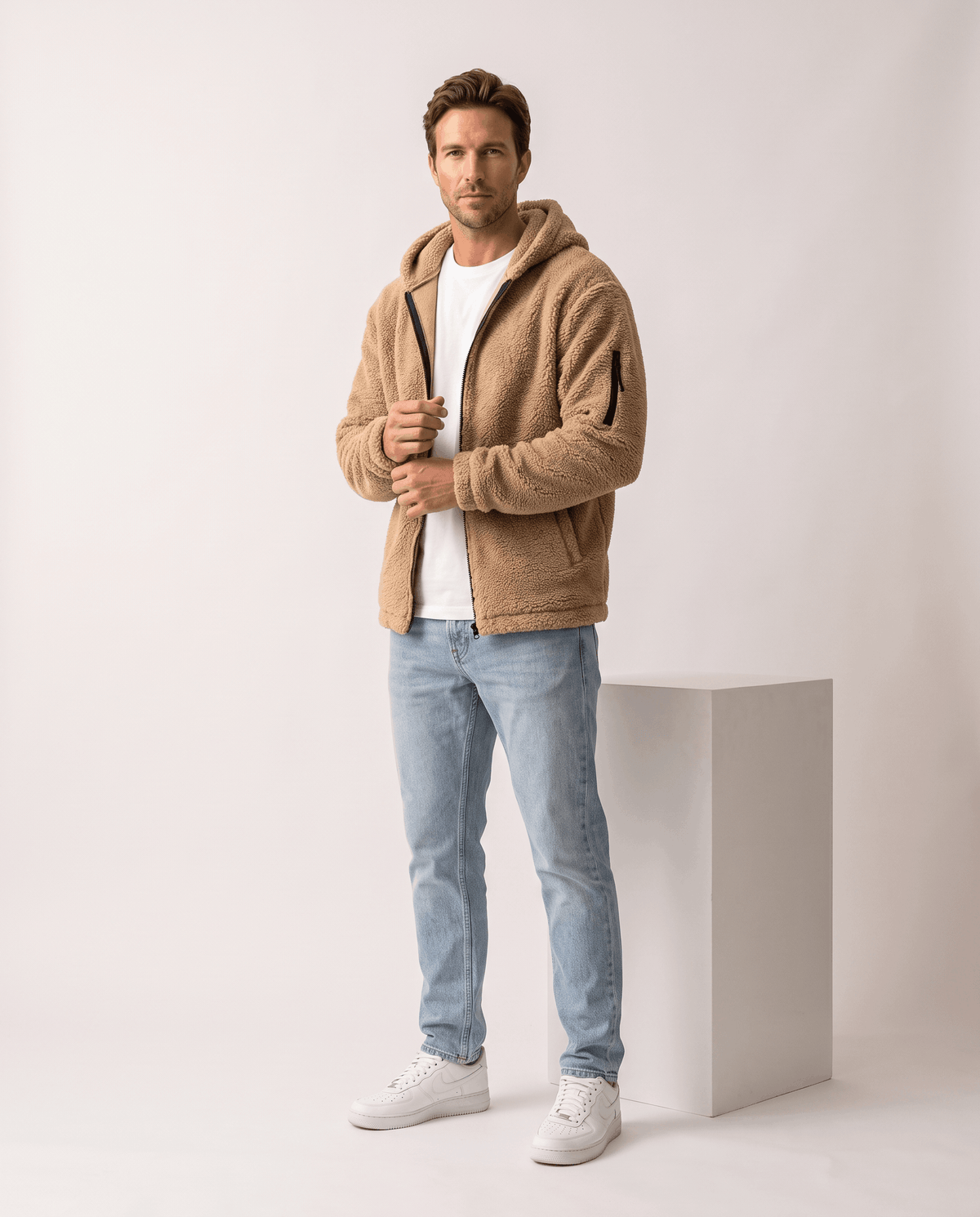 Full-length khaki outfit styled with light jeans and white sneakers