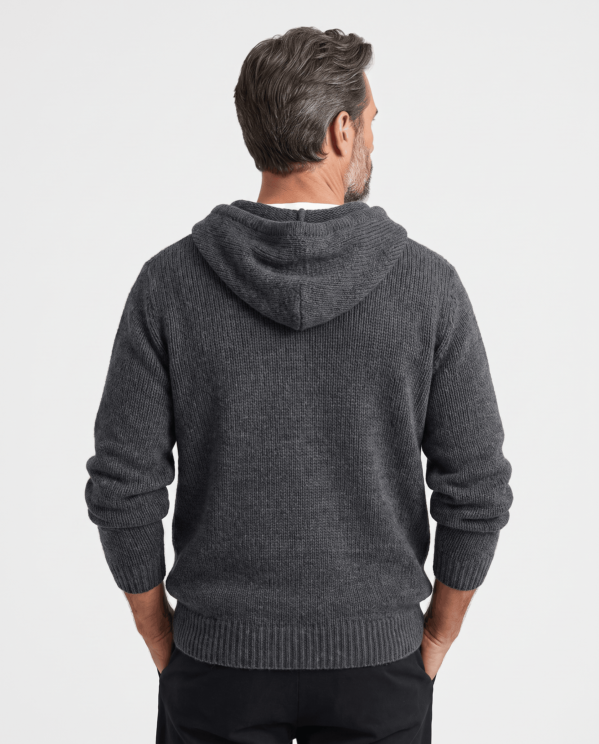 Back view of a dark gray knit sweater with the hood lying flat