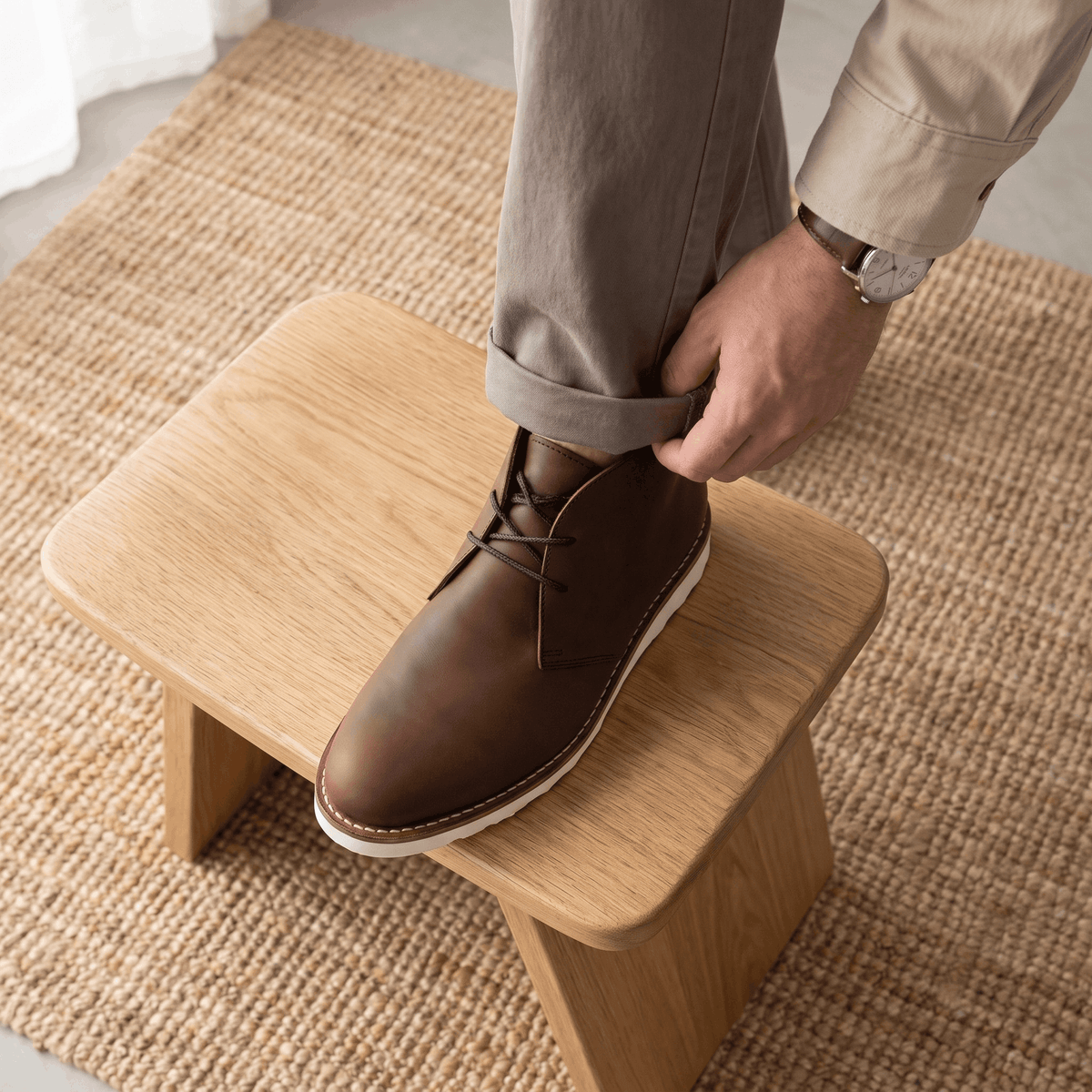 Wide scalloped outsole under a plain matte two-eyelet chukka boot.