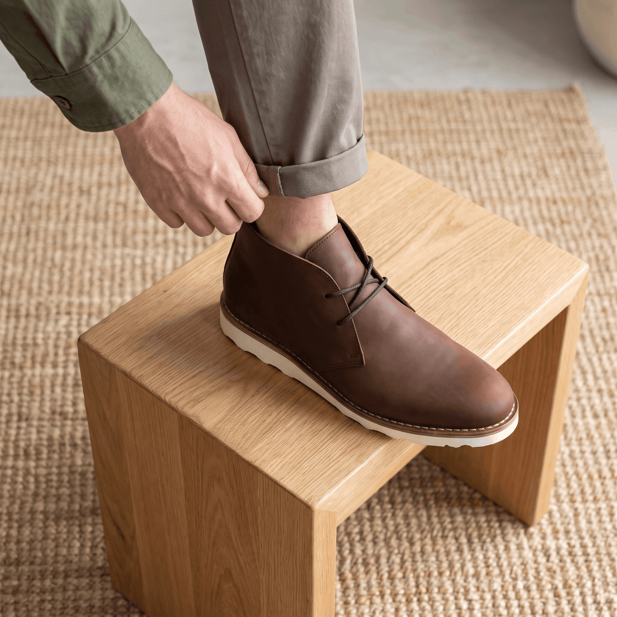 Ankle-height chukka boot with a matte finish and a notched rubber sole.