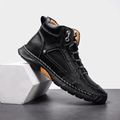 Black vegan leather ankle hiking boot with a wide toe box, mesh side panels, contrast stitching, and a rugged lug outsole.