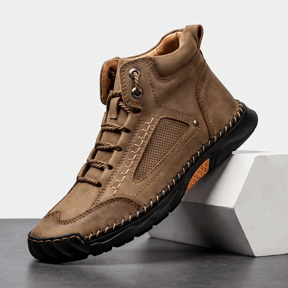 Camel vegan leather ankle hiking boots featuring a wide toe box, mesh side panels, and a rugged black lug outsole.